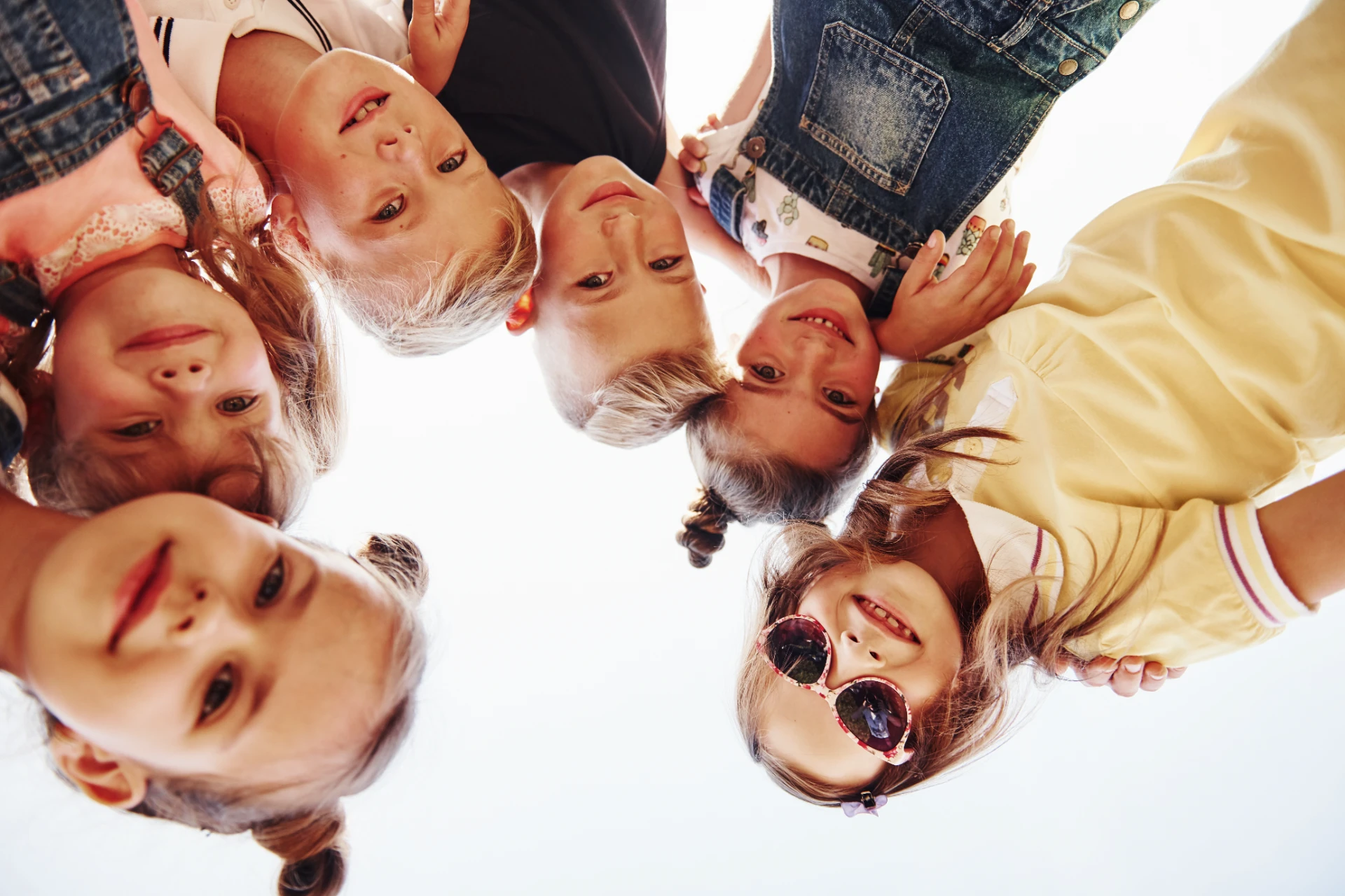group-of-children-look-down-into-camera-2026-03-24-06-03-08-utc